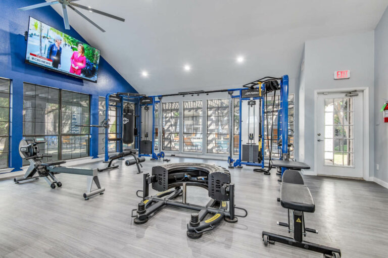 Fitness Center with large tv and weight lifting equipment