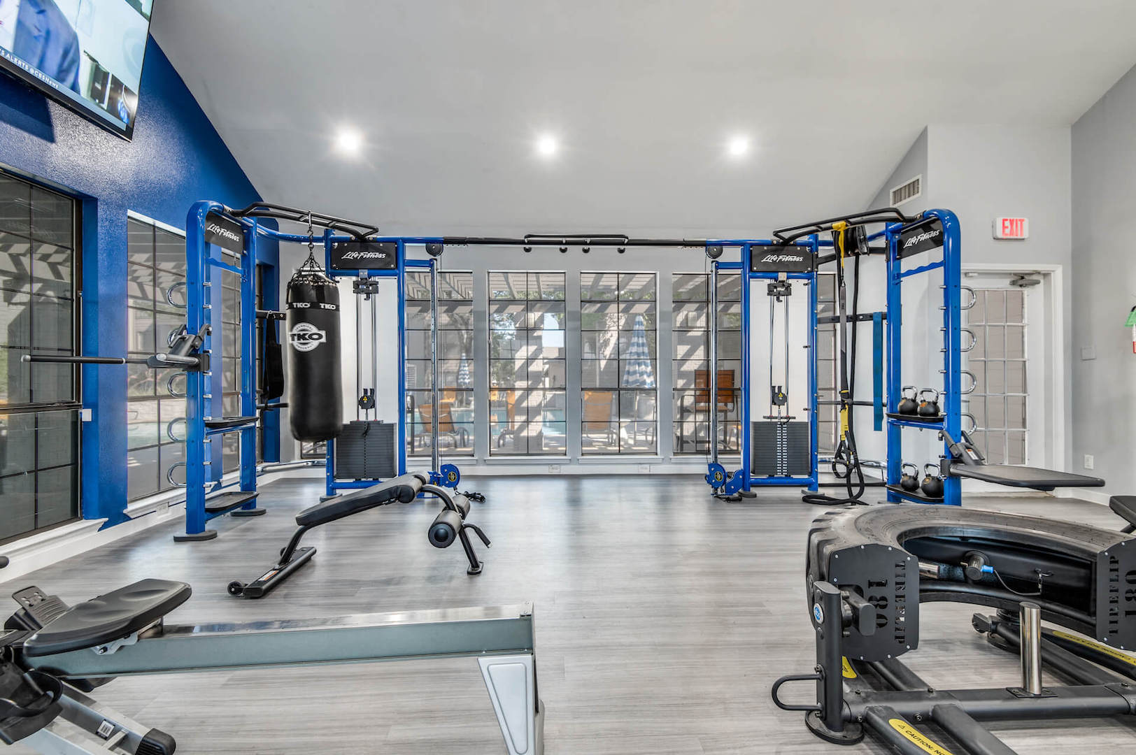 Fitness center with weight lifting equipment , large window in back